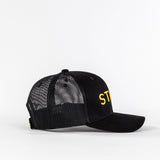 Black mesh trucker hat with yellow 'STE' embroidery on white background