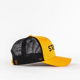 Yellow and black mesh trucker hat with embroidered ST letters on plain white background