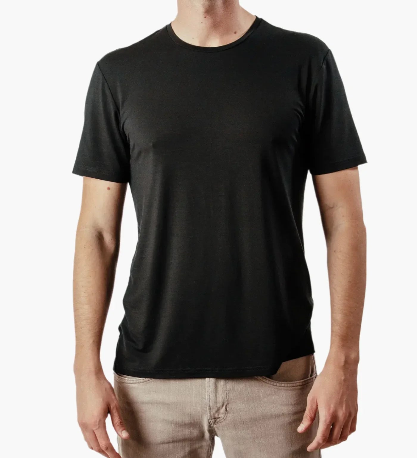 Man wearing plain black short sleeve t-shirt front view on white background