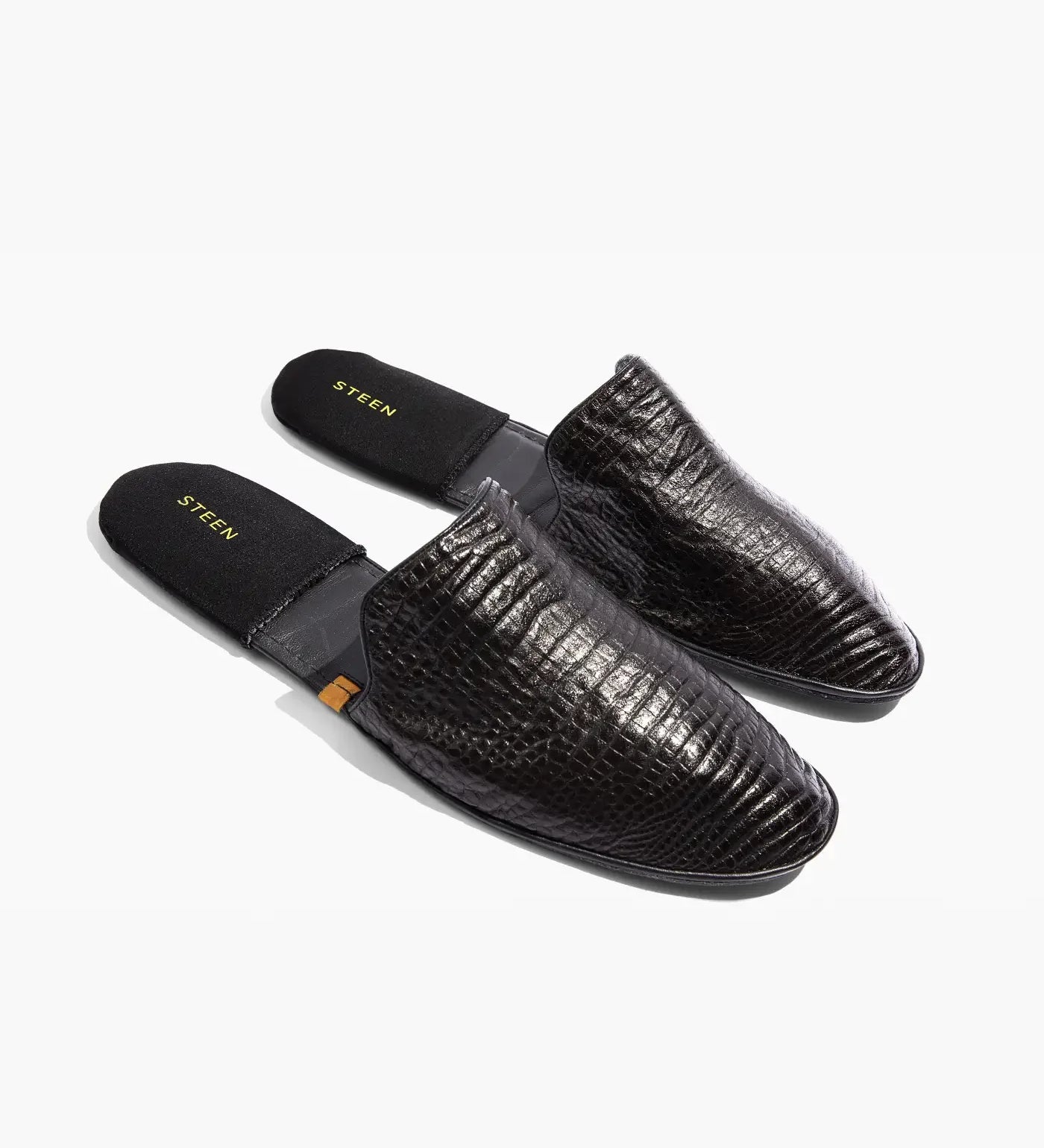 Steen black men's slippers with textured leather finish, top view on white background
