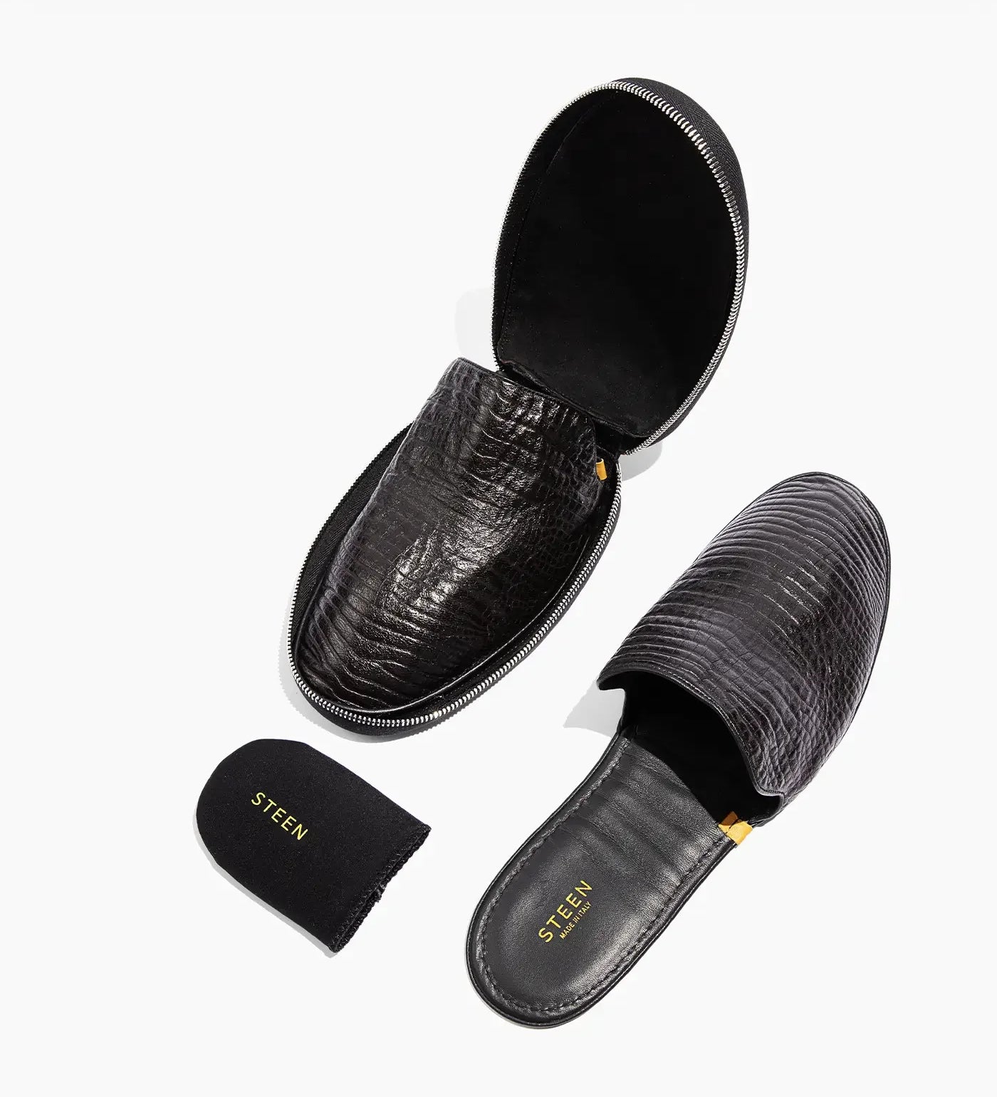 Steen men's black leather slippers with textured finish, including carrying pouch and case.